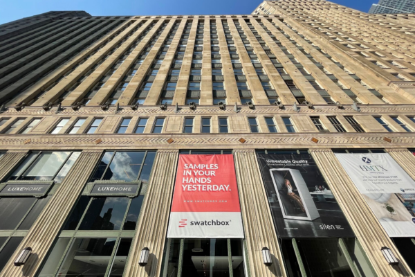 new durasein brand partner, swatchbox, banner hangs at design conference, outside of large building in the city